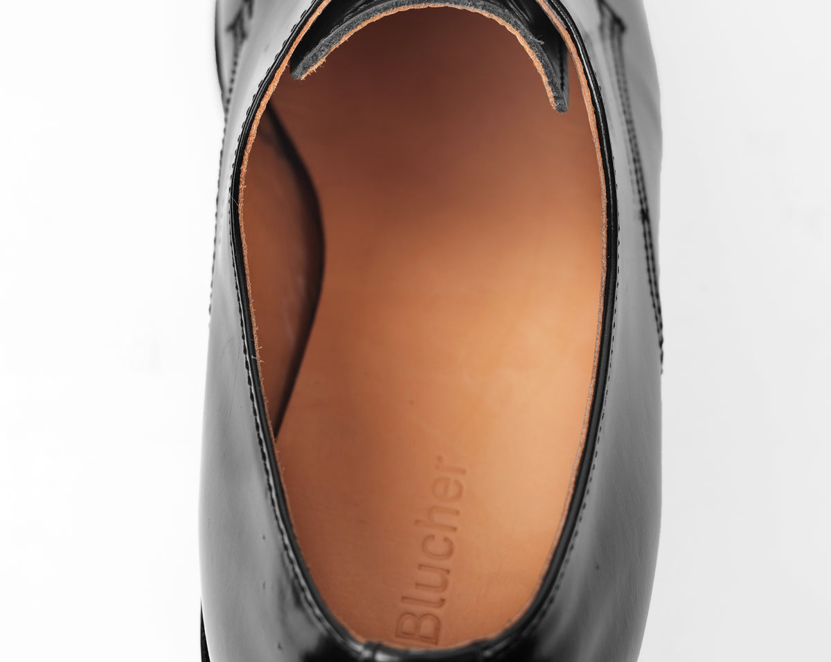 Interior view of black Goodyear welted Blucher shoe with cow hide leather lining