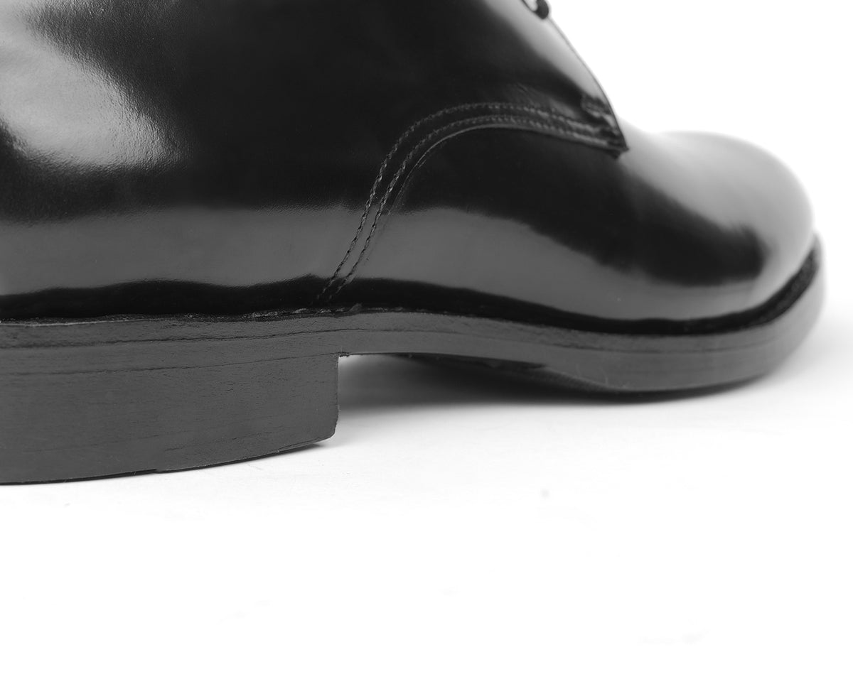Leather footbed of black Goodyear welted Blucher shoe with visible stitching