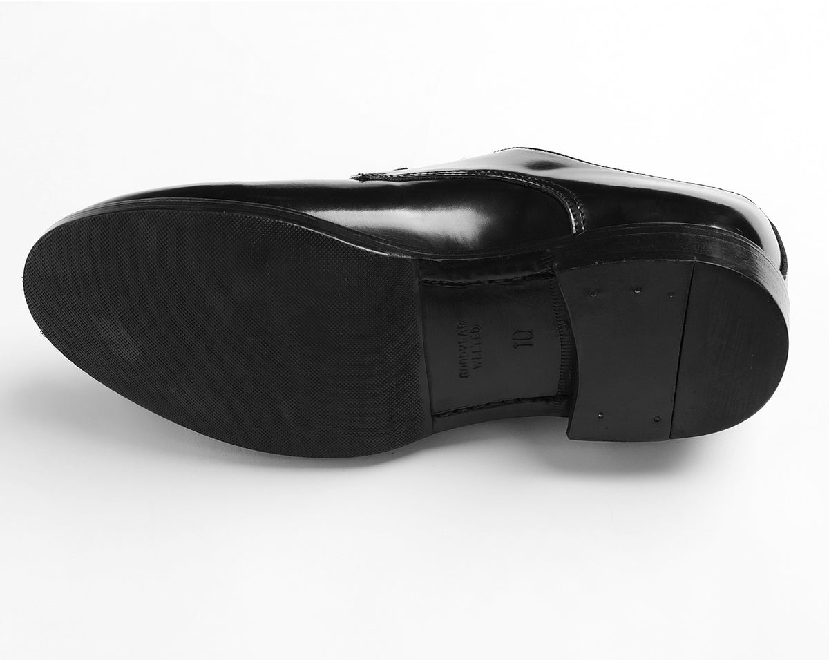 Leather sole of black Goodyear welted Blucher shoe highlighting construction