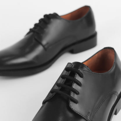 Close-up of Blucher Classic Executive black leather Blucher shoe with lace detail