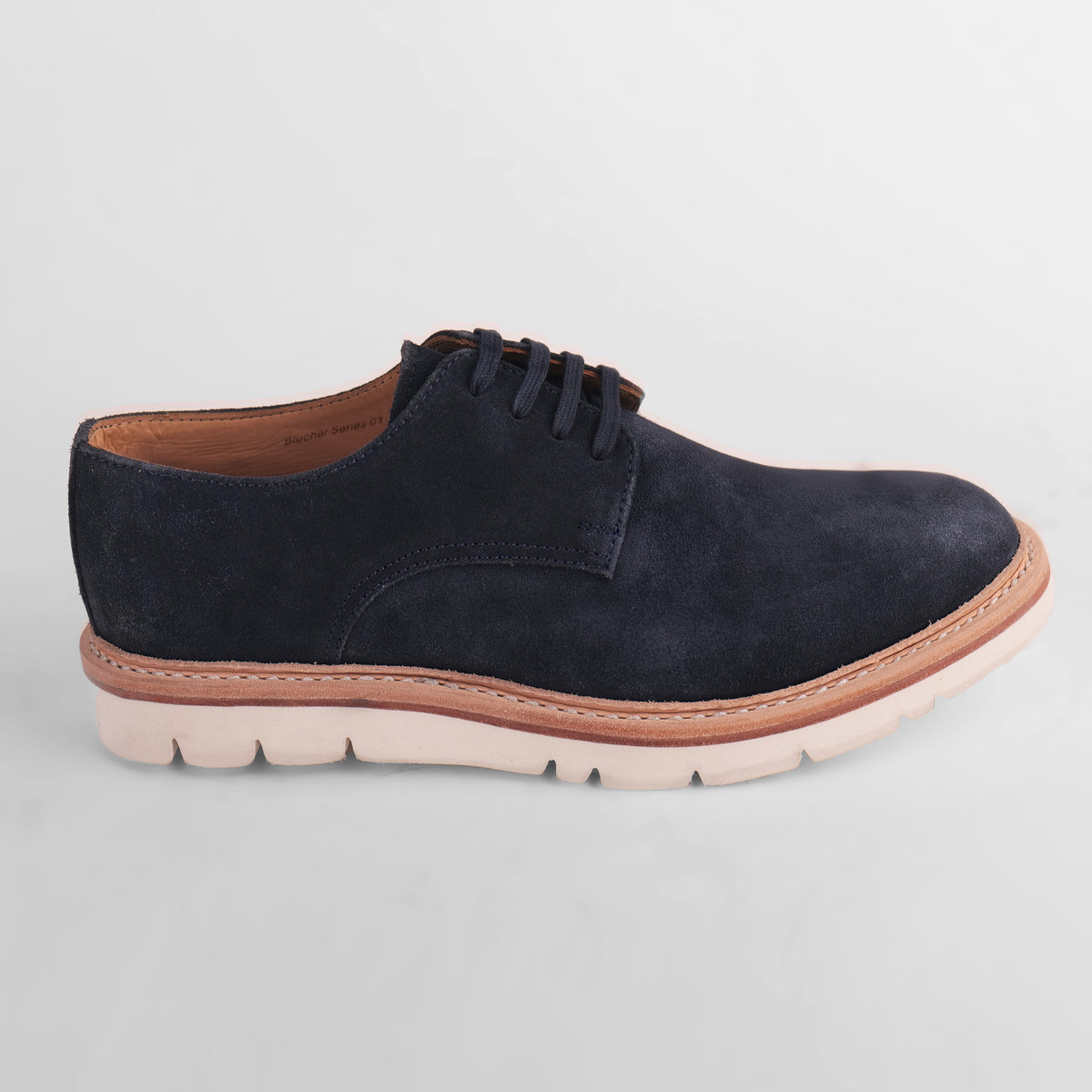 Side view of a single navy blue Blucher Suede shoe