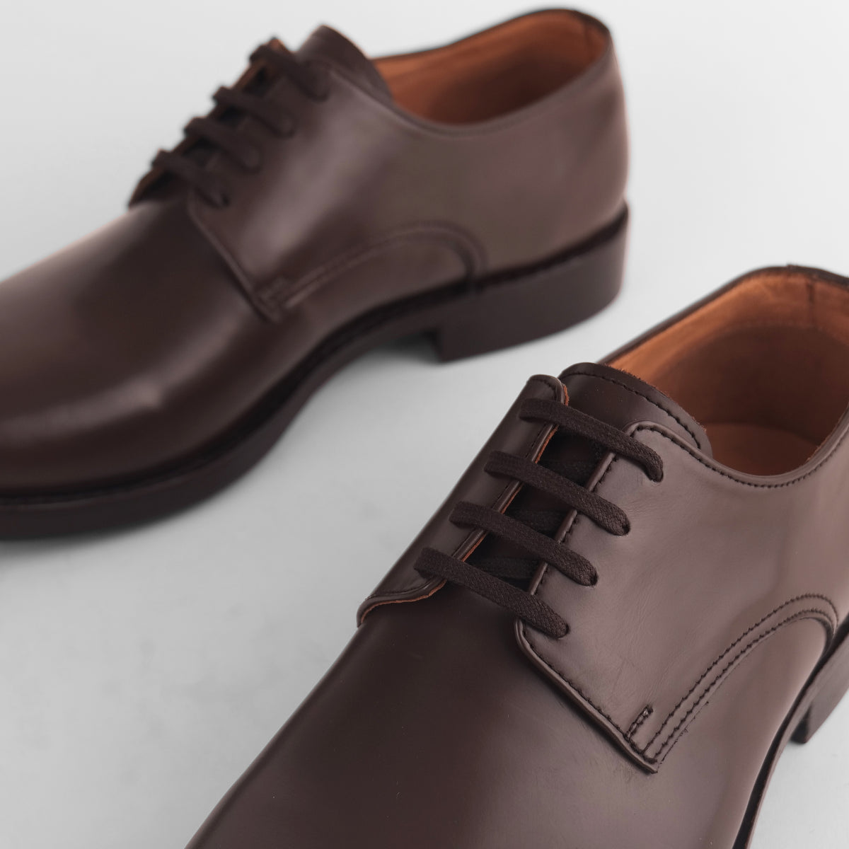 Close-up of brown Blucher Goodyear welted shoes highlighting lace detail