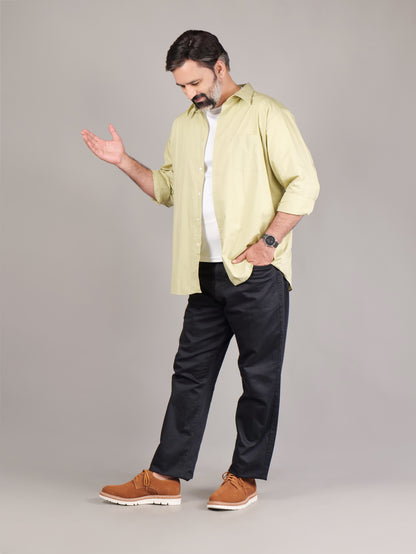 Male model wearing brown Blucher Suede shoes while standing against a beige studio background