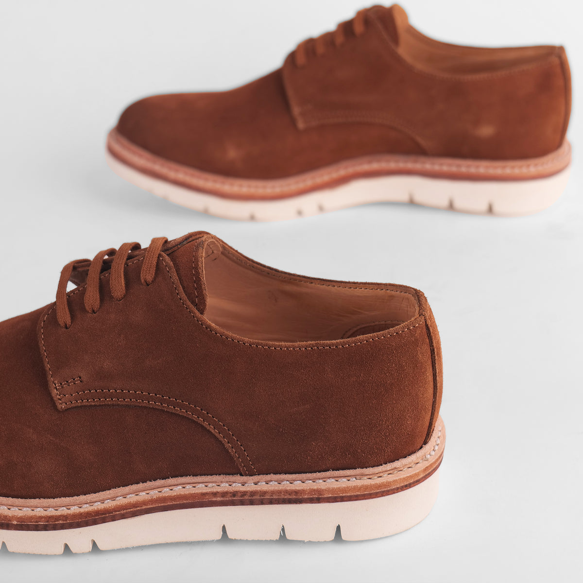 Side view of a pair of brown Blucher Suede shoes