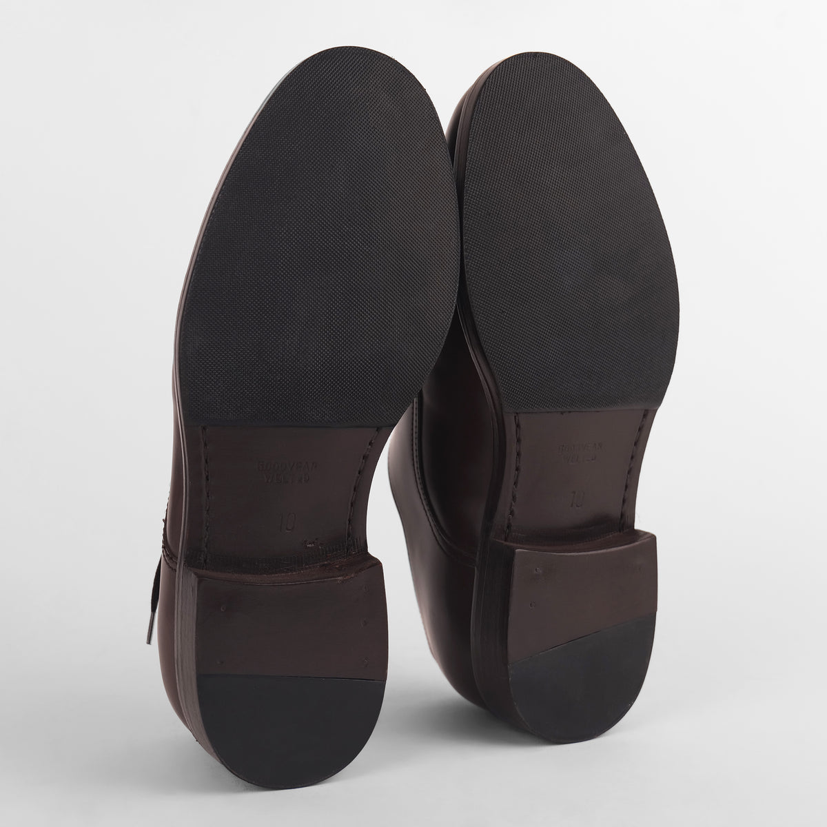 Sole view of brown Goodyear welted Blucher shoes showing tread and construction