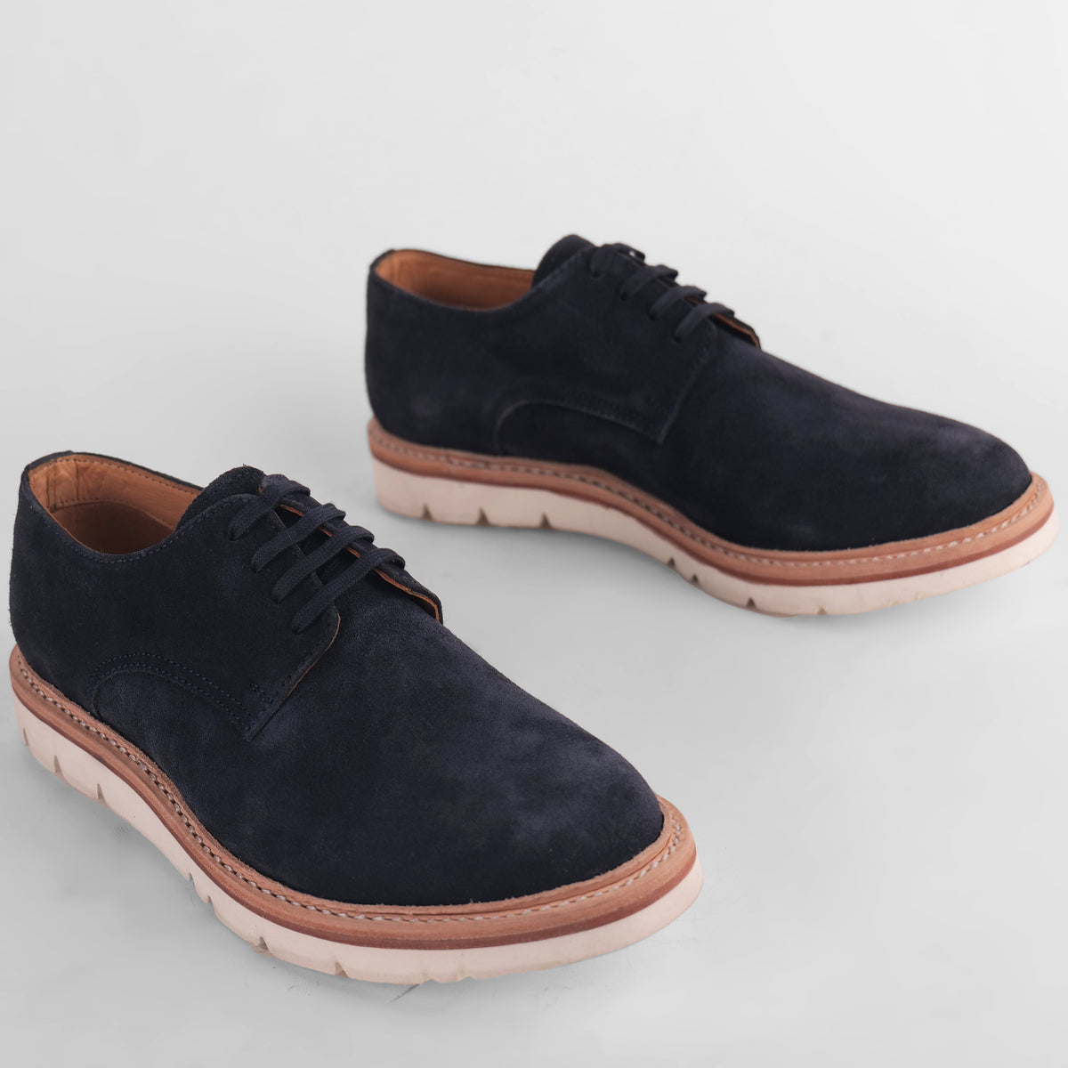 Top view of a pair of navy blue Blucher Suede shoes